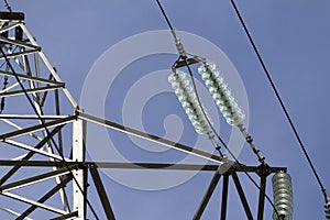 Power lines construction and isolators with blue sky