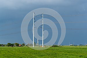 Power lines crossing a rural landscape photo