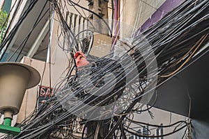 Power lines electric cables in the city streets of Hanoi, Vietnam