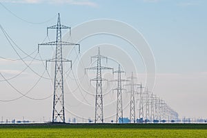 Power lines - electricity poles in the field