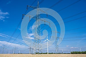 Power lines, electricity pylons and wind turbines