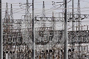 Power lines feeding into an electrical grid use to power an industrial area.