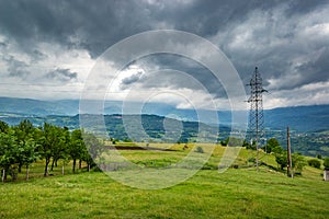 Power lines in the mountains. Cloudy day