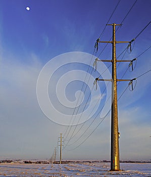 Power Lines Run Along Giant Steel Towers on the Colorado Plains.