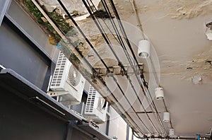 Power lines run under ceiling of worn out canopy