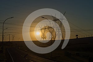 Power lines at the sunset near Itaipu dam photo