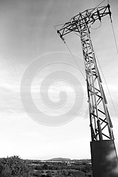 Power lines tower under clear sky in the countryside