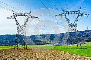 Power lines voltage towers photo