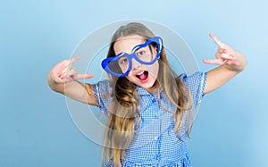 Power of love. Kid girl heart shaped eyeglasses. Girl adorable smiling face fall in love. Child charming smile blue