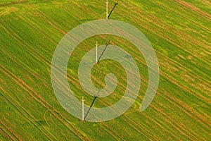 Power mast for high voltage electricity with cables in field