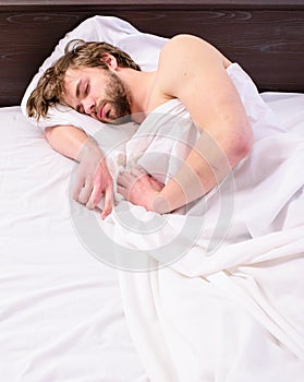 Power napping may help you get through day. Have nap relax. Man sleepy drowsy unshaven bearded face covered blanket