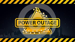 Power outage, yellow warning logo wrapped with a garland on the background of the city without electricity