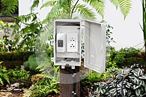 The power outlet in the protection box with stand outside at the