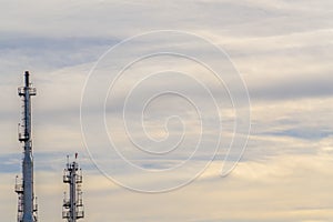 Power Plant with cloud filled sky in background