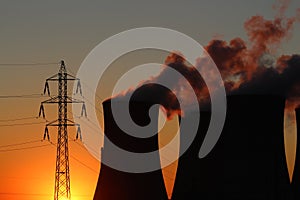 Power plant and high voltage tower during sunset