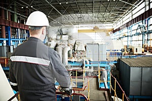 Power plant maintenance. Industial worker engineer