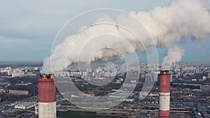 Power plant pipes on the background of the panorama of the winter city against blue sky in Moscow