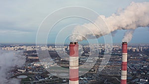 Power plant pipes on the background of the panorama of the winter city against blue sky in Moscow