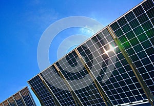 Power plant using Solar panels solar cell in solar farm with blue sky and cloud background