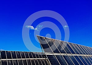 Power plant using Solar panels solar cell in solar farm with blue sky and cloud background