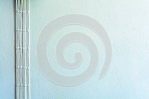 Power plug on the white cement wall