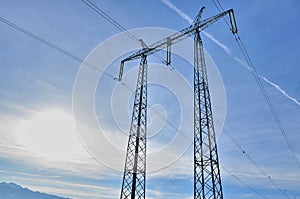 Power pole against blue sky