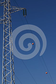 Power pole with red balls