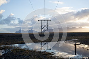 Power pole with sunset in Iceland. Light and shadow over the lan