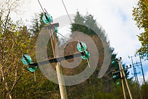 Power poles with green glass insulators