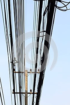 Power poles and many telephone lines.