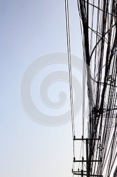 Power poles and many telephone lines.