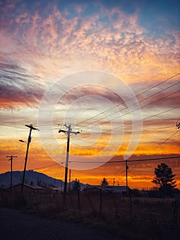 Power Poles Silhouetted Against a Beautiful Arizona Desert Sunrise.