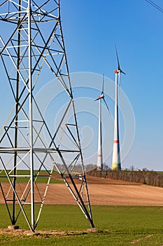 Power poles and wind turbines are symbols of the German Energiewende