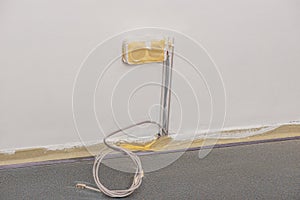 Power socket covered with masking tape while the wall being painted