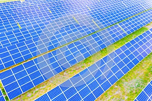 Power solar panel on blue sky background,alternative clean green energy concept. Aerial view of Solar panels Photovoltaic systems
