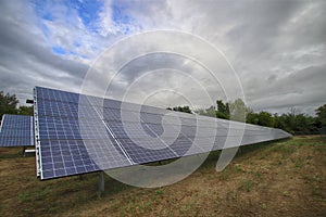Power solar panel on blue sky background,alternative clean green energy. HDR photo