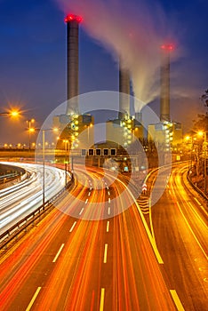 Power station and highway at dawn