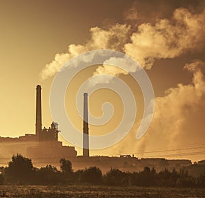 Power station with smoking chimney