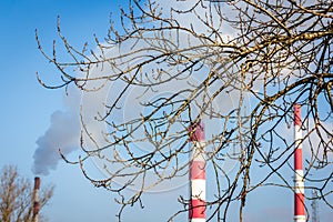 The power station with three smoke stacks in the background