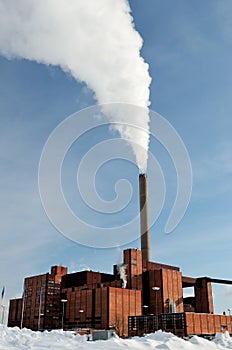 Power station in winter, steam from stack