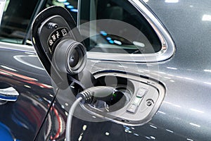 Power supply connect to electric vehicle for charge to the battery. Charging technology industry transport which are the