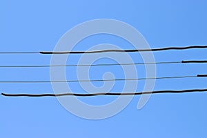 power supply line in front of blue sky