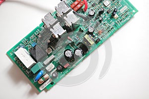 Power Supply modern printed-circuit board with electronic components with transistor. PCB detail