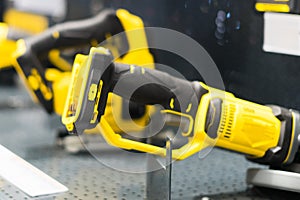 Power tools, drills and hammers of various manufacturers are sold in a hardware store. photo