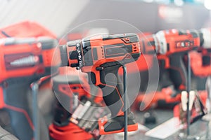 Power tools, drills and hammers of various manufacturers are sold in a hardware store. photo