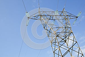 Power tower and transmission lines on blue background