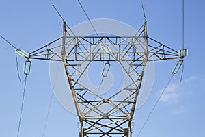 Power tower and transmission lines on blue background