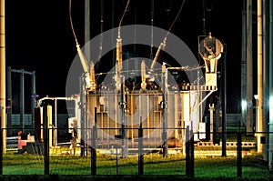 Power transformers by night photo