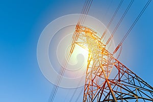 power transmission line with sun light photo