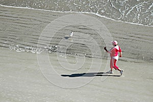 Power walking on beach